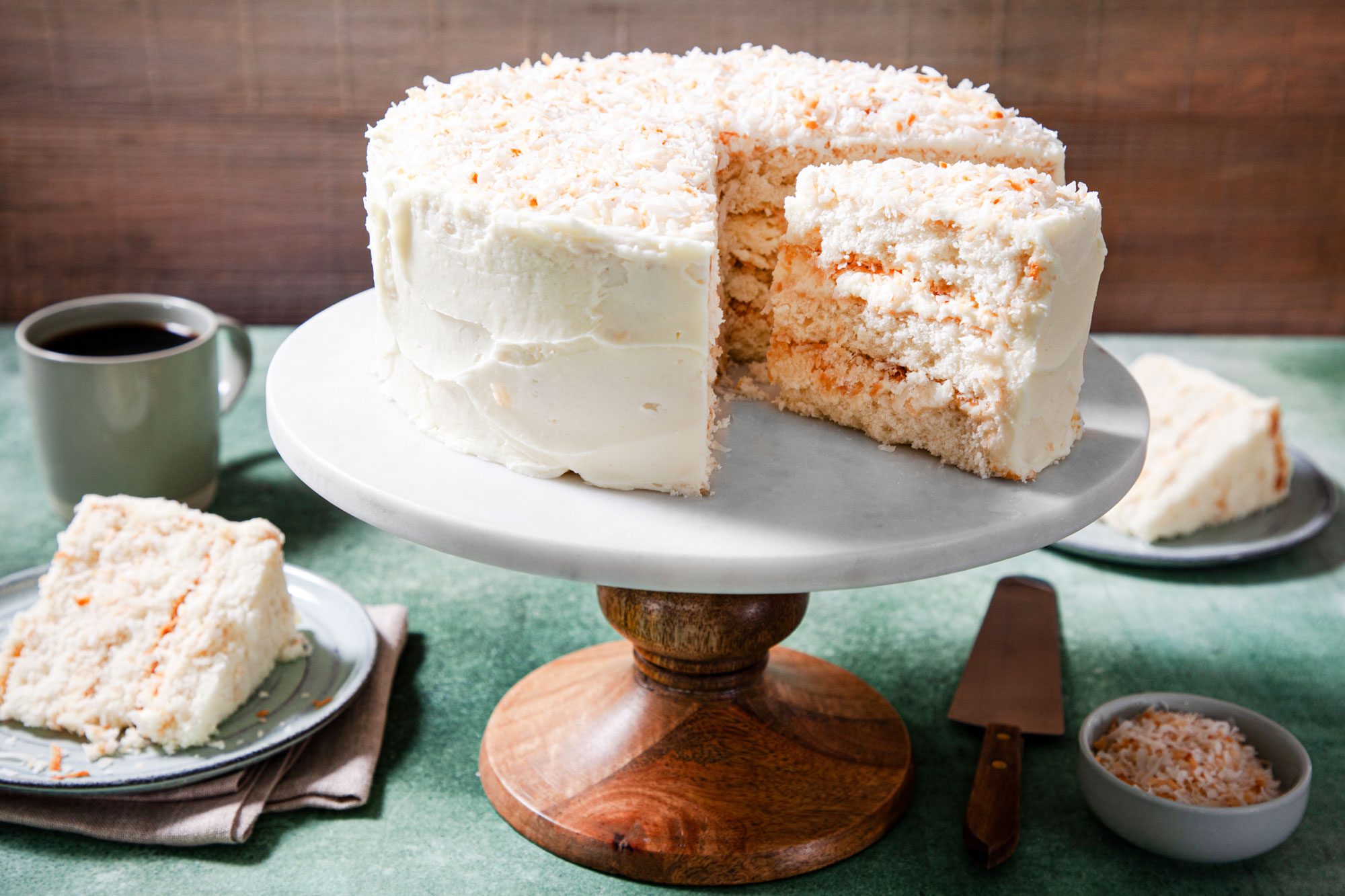 A delicious coconut cake presented on a cake stand