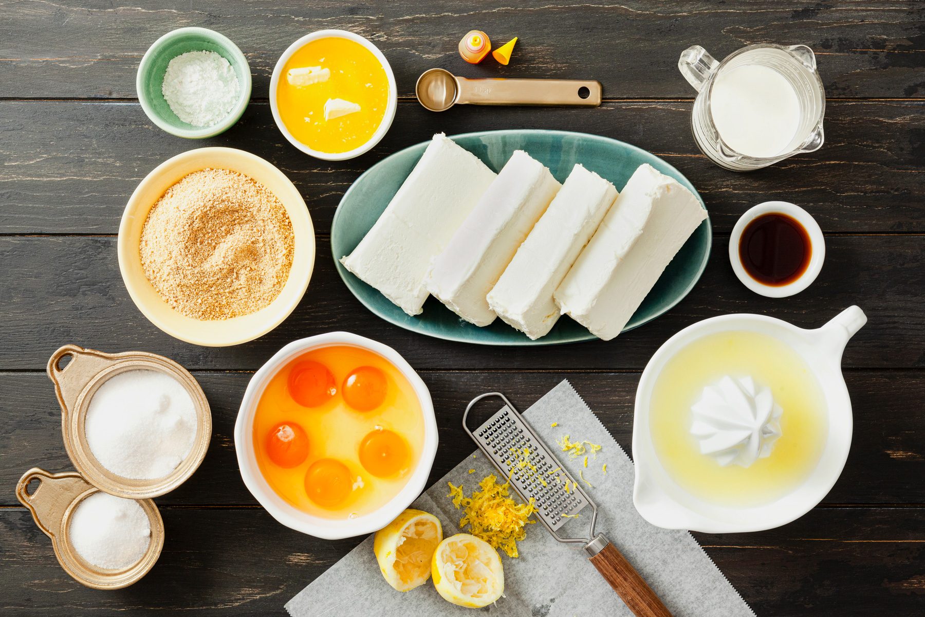 Ingredients for Lemon Cheesecake on wooden table