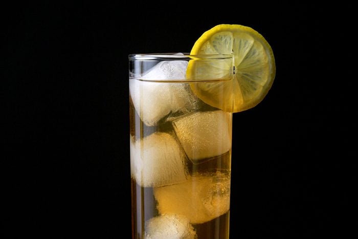 A Highball Glass of Long Island Iced Tea with Black Background