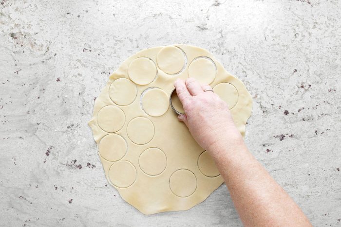 Cutting round shapes on dough with dough cutter