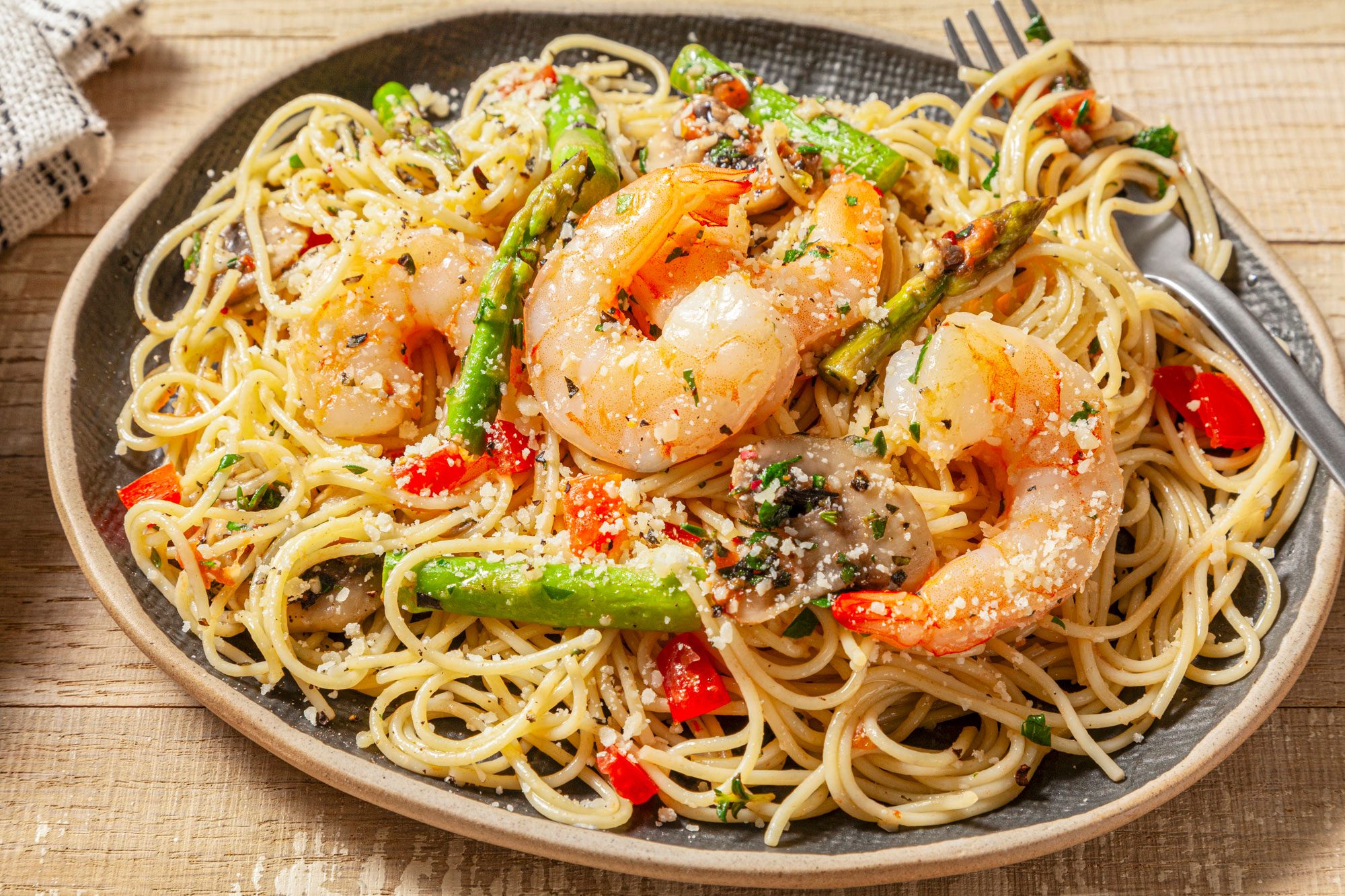 A delicious plate of Shrimp Pasta Primavera served with spaghetti