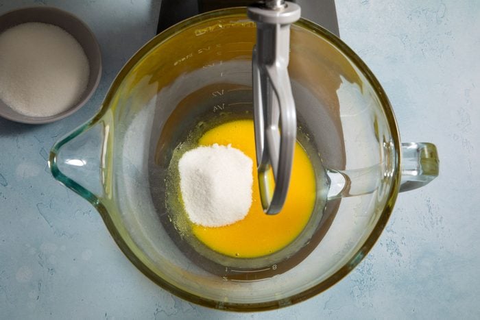 Egg yolks in a blender mixed with sugar