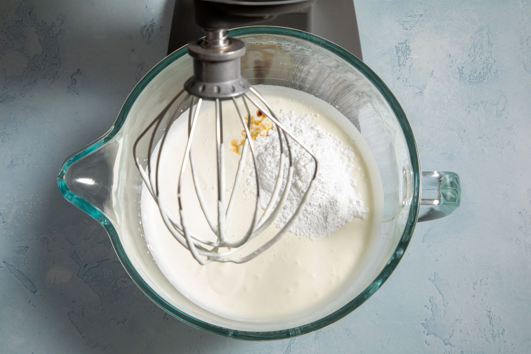 White sugar vanilla and cream mixed in a blender