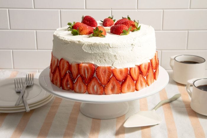 Strawberry Cream Cake on a serving plate on a table