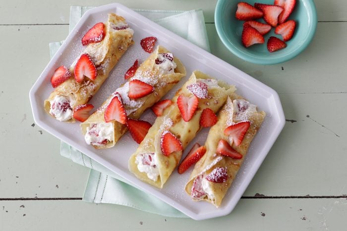 Garnish with strawberries and confectioners' sugar