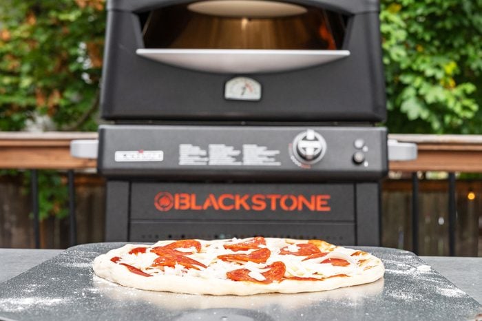 Blackstone Pizza Oven with pizza in front