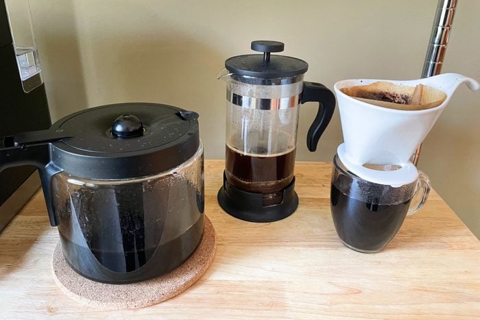 Black coffee inside coffee maker on a table