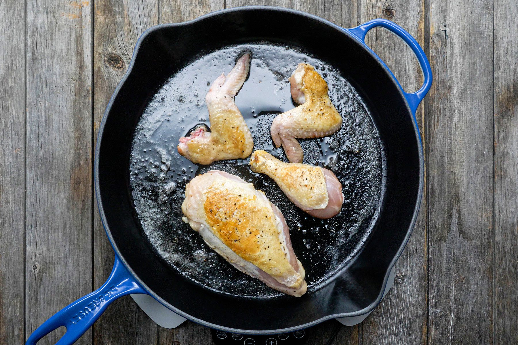Browning the chicken on large skillet