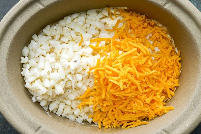 Hash browns and cheese in bowl