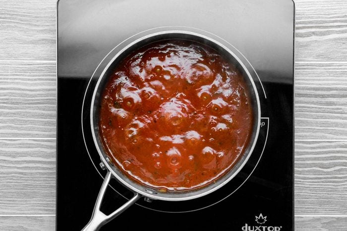 Making sauce in large saucepan
