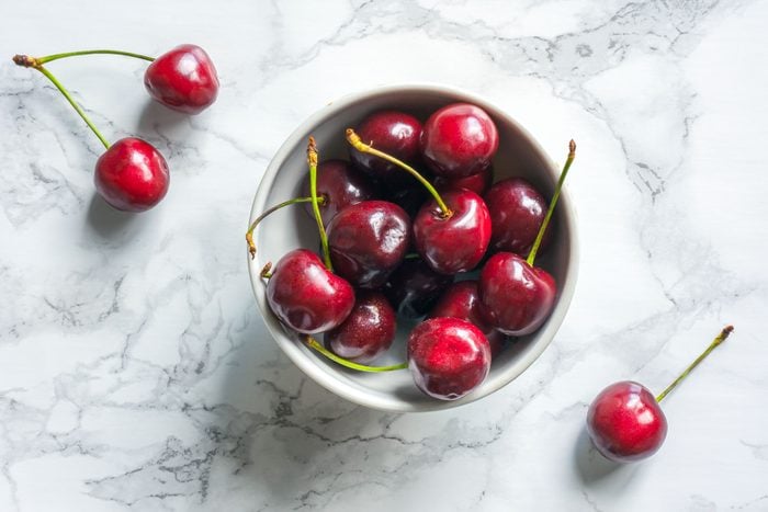 Fresh cherry berries on marble background