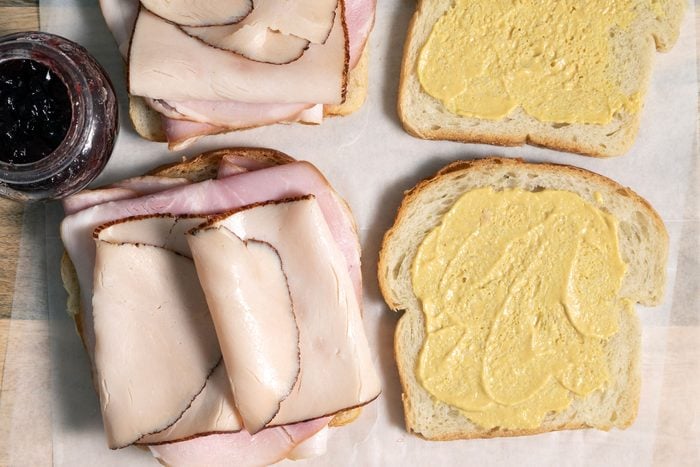 Sliced ham on a slice of bread