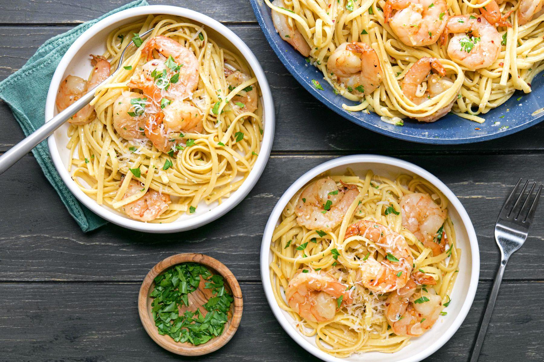 A group of bowls of pasta with shrimp