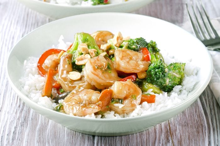 Delicious shrimp stir-fry with rice and vegetables served in a bowl