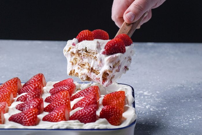 Strawberry Icebox Cake scooped out of a large pan