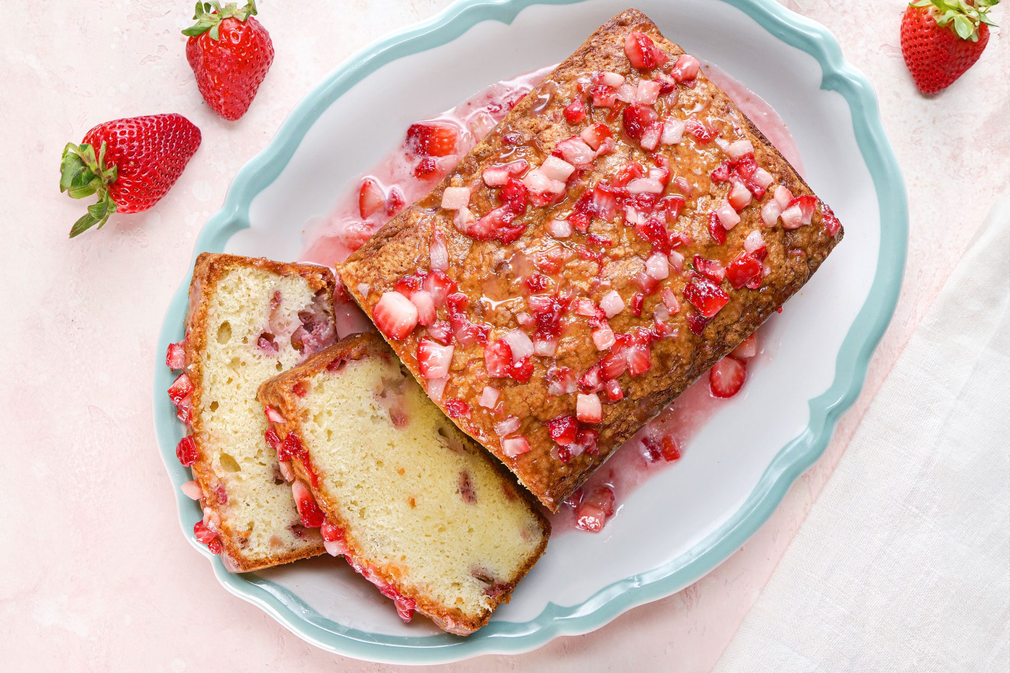 Freshly baked Strawberry Pound Cake loaf on a plate