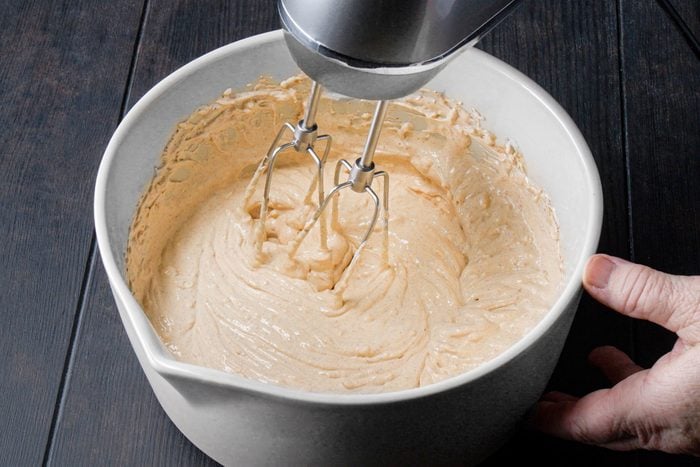 In a large bowl mixing cream cheese and sour cream using a hand mixer